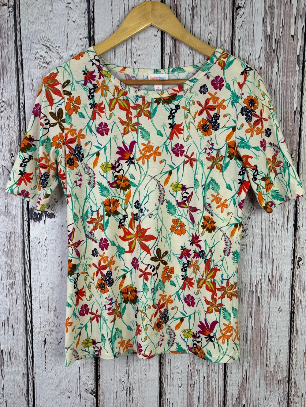 LuLaRoe Fitted GiGi Top Size Medium Floral Pattern Cream Background Half Sleeves